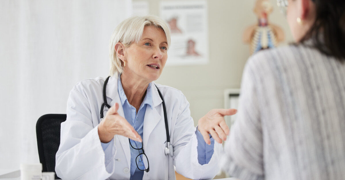 Doctor speaking to patient