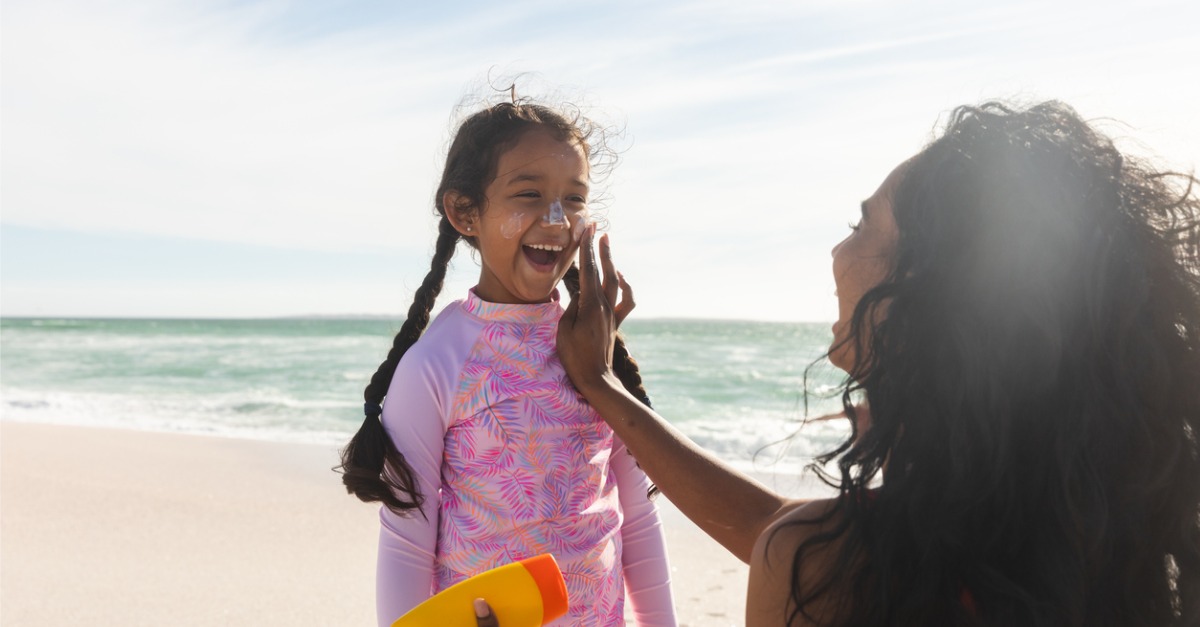 Mother and daughter happy at the beach